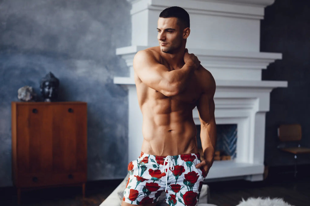 Marcuse Amour shorts white swim trunks with red rose pattern and drawstring waistband for beachwear
