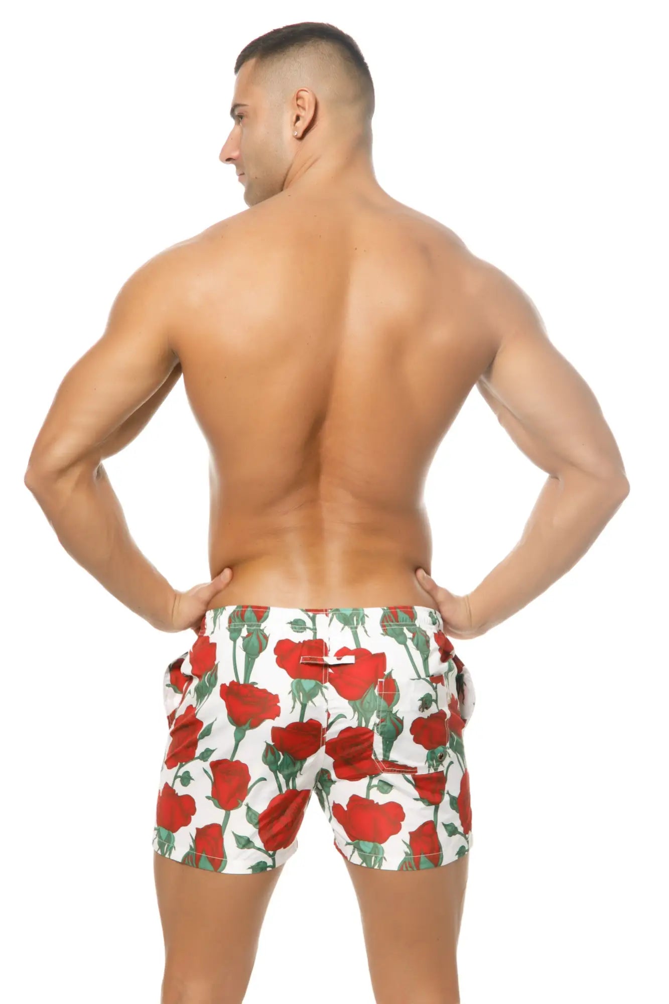 Marcuse Amour white swim trunks with vibrant red rose and green stem pattern perfect for beachwear