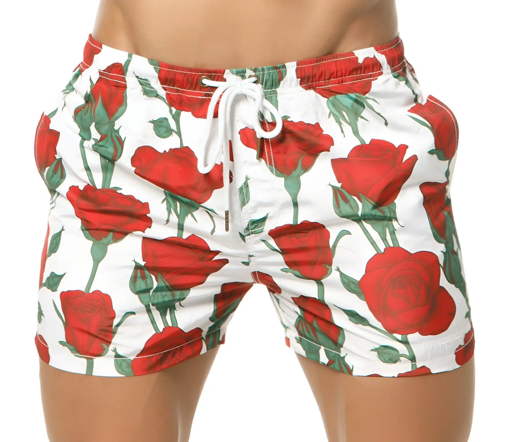 Marcuse Amour shorts white swim trunks with vibrant red rose pattern green stems leaves and white drawstrings
