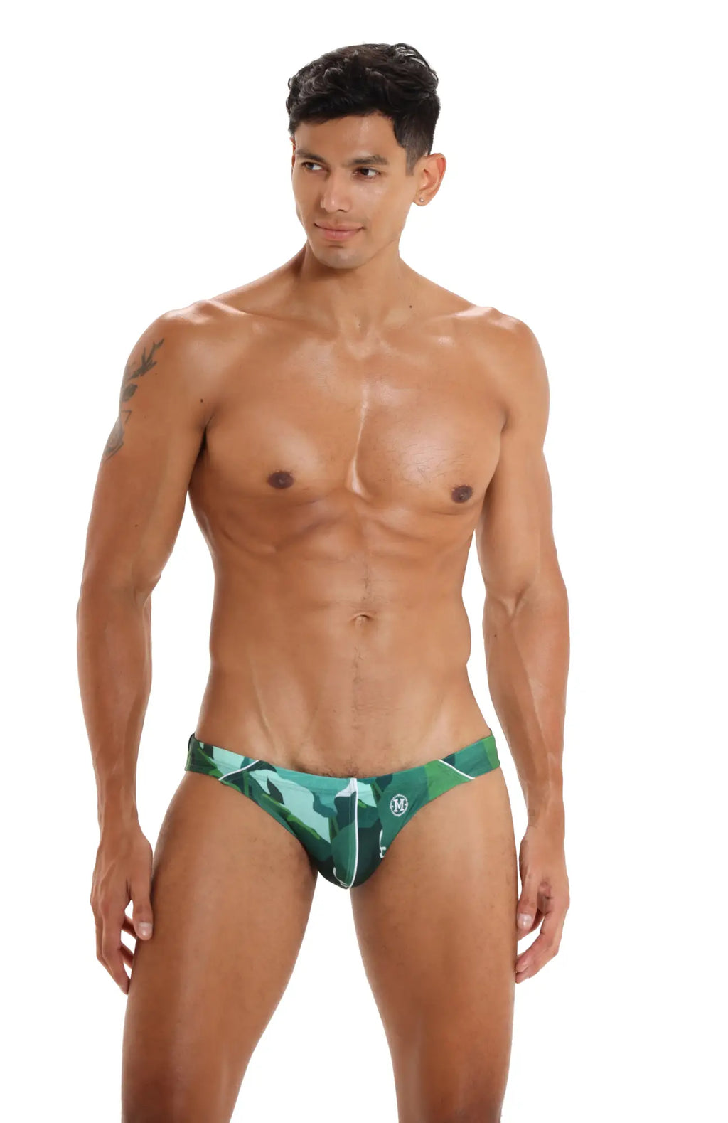 Green camouflage-patterned marcuse anemone bikini swimwear trunks with a small logo on the front