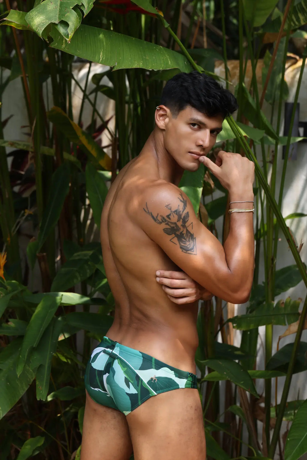 Green and white tropical leaf-patterned swim trunks from marcuse anemone bikini swimwear for beachwear