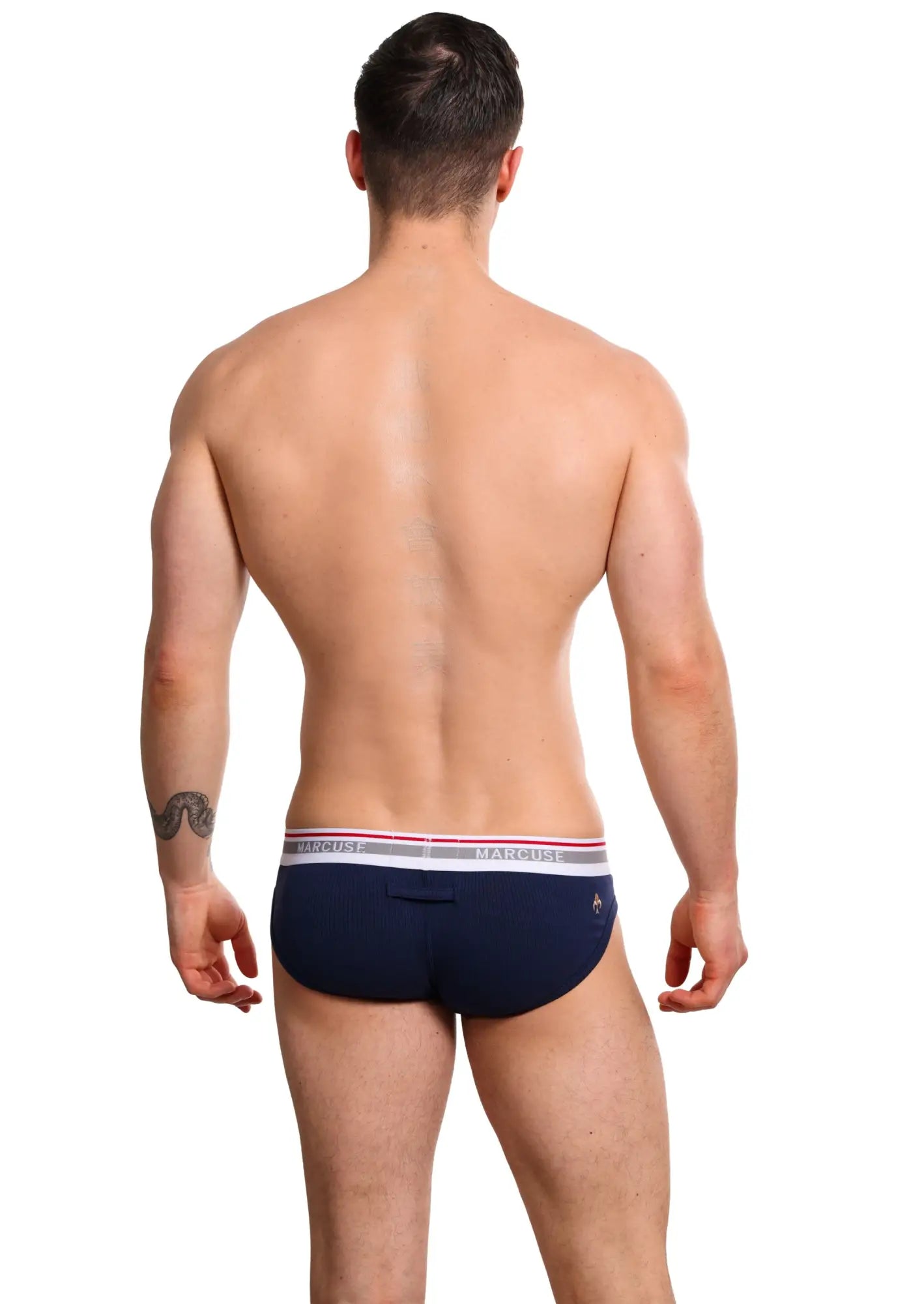 Marcuse Apollo brief underwear in navy blue with a white and pink striped waistband and macho brand name
