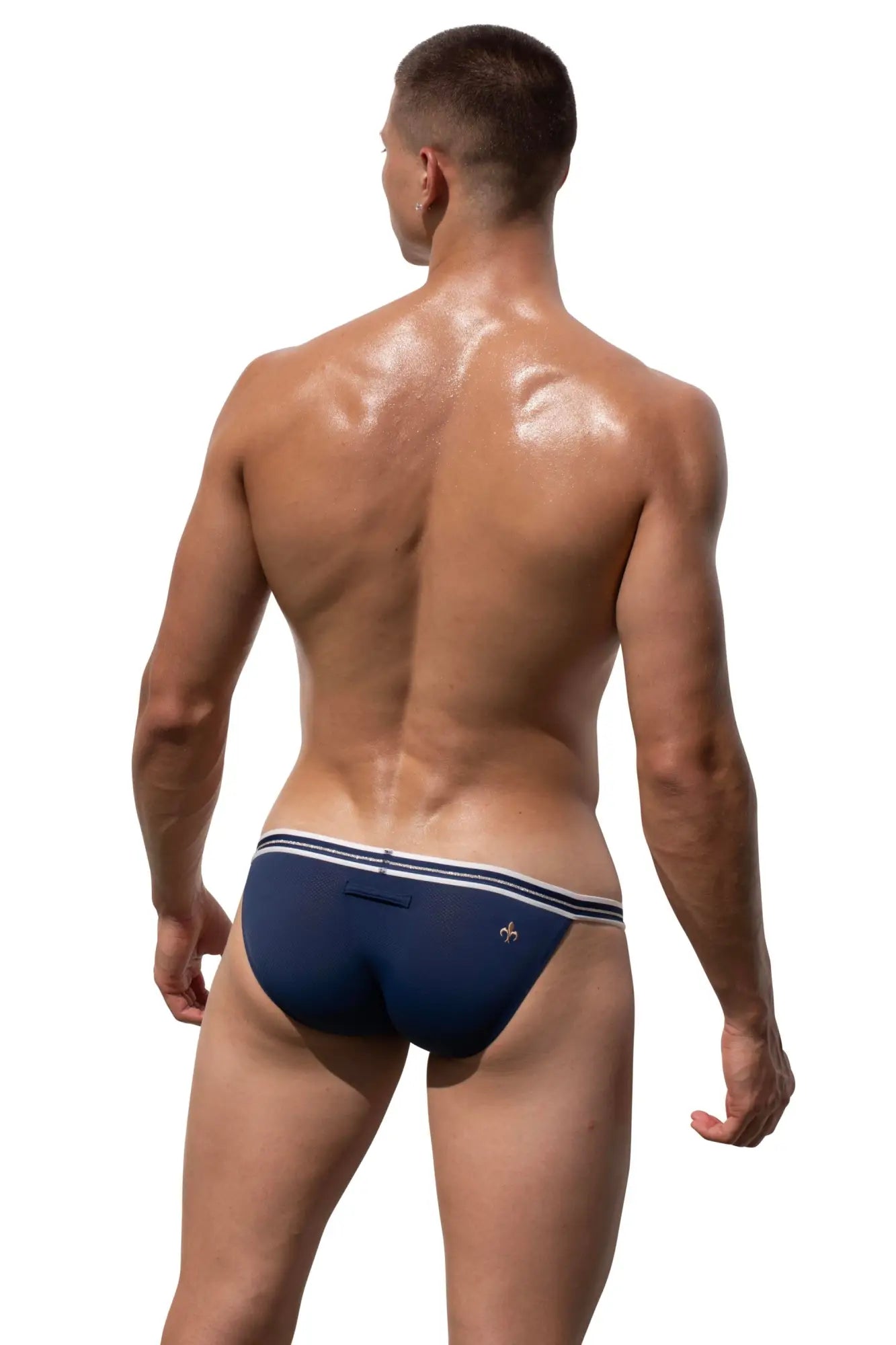 Back view of navy blue Marcuse Arose brief underwear with white trim and a small logo on the back