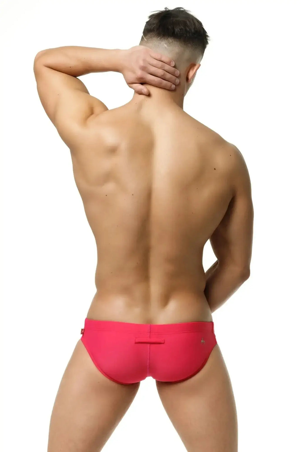 Bright pink marcuse arrest me bikini swimwear swim trunks back view with sleek form-fitting design and flap closure