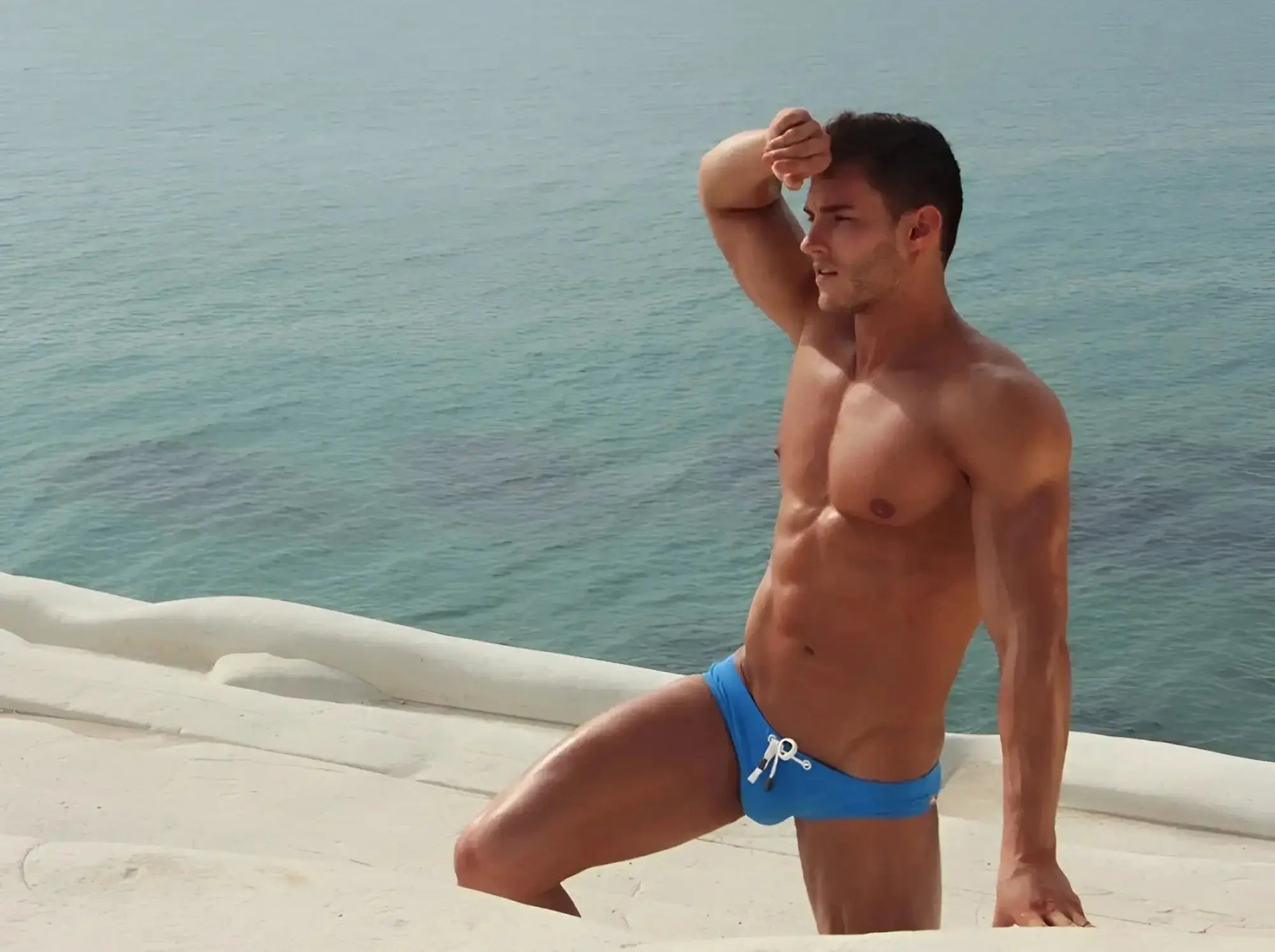 Blue Marcuse Arrest Me bikini swimwear swim trunks with white drawstring ties for beach and pool use