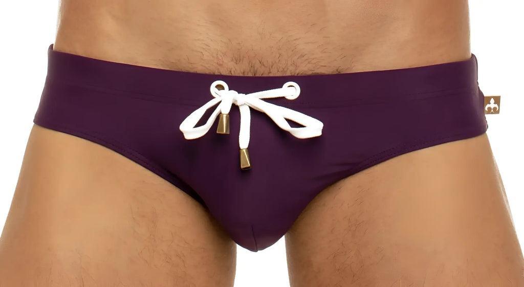 Marcuse Arrest Me bikini swimwear purple swim trunks with white drawstring and gold-tone aglets