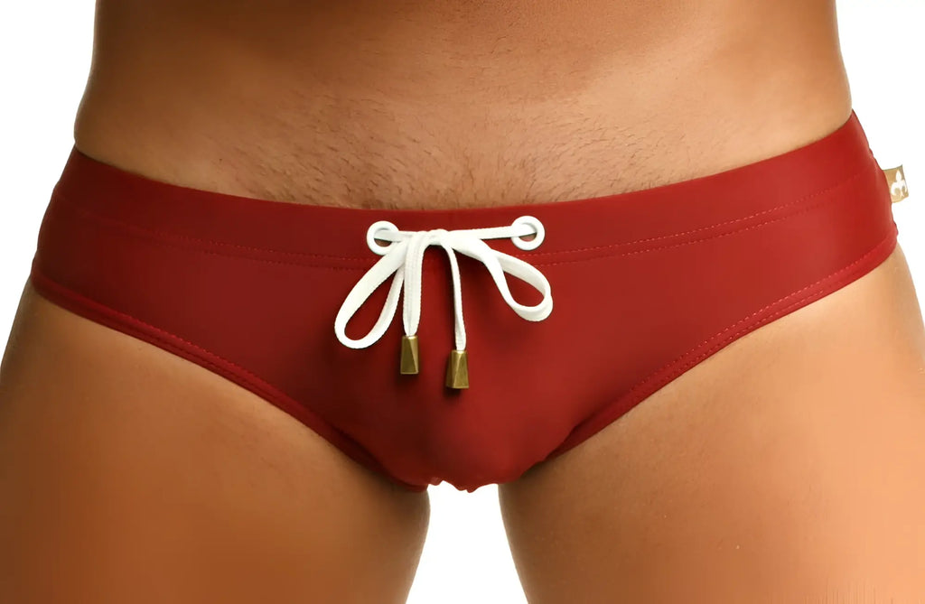 Marcuse Arrest Me bikini swimwear red swim trunks with white drawstring and gold tone aglets for swimming