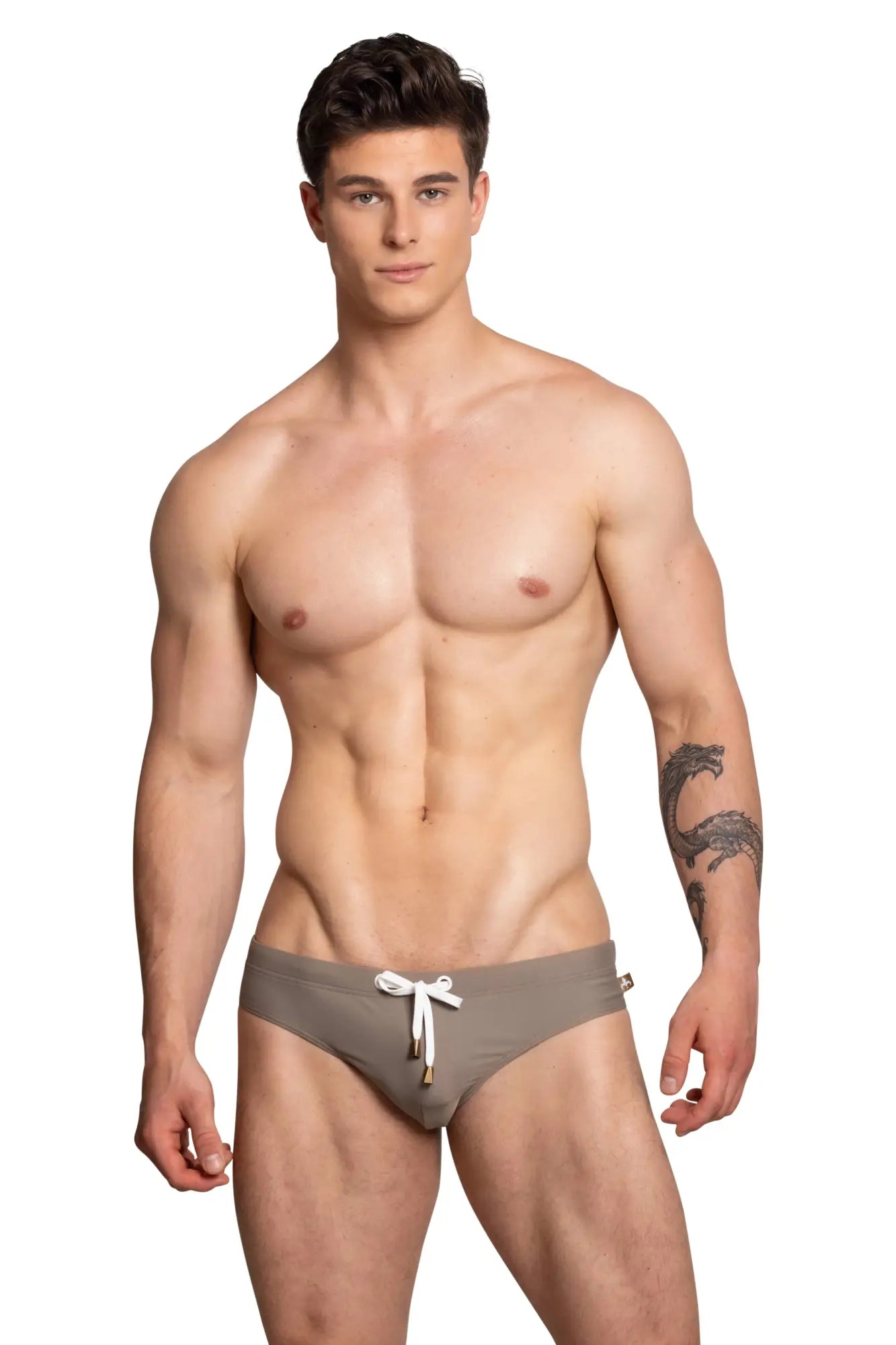 Marcuse Arrest Me bikini swimwear taupe swim trunks with white drawstring and subtle gold-tone hardware