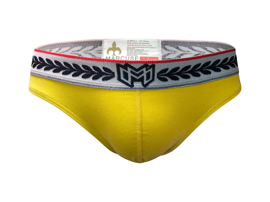 Bright yellow marcuse astra thong underwear with gray waistband featuring black leaf patterns and marcuse logo