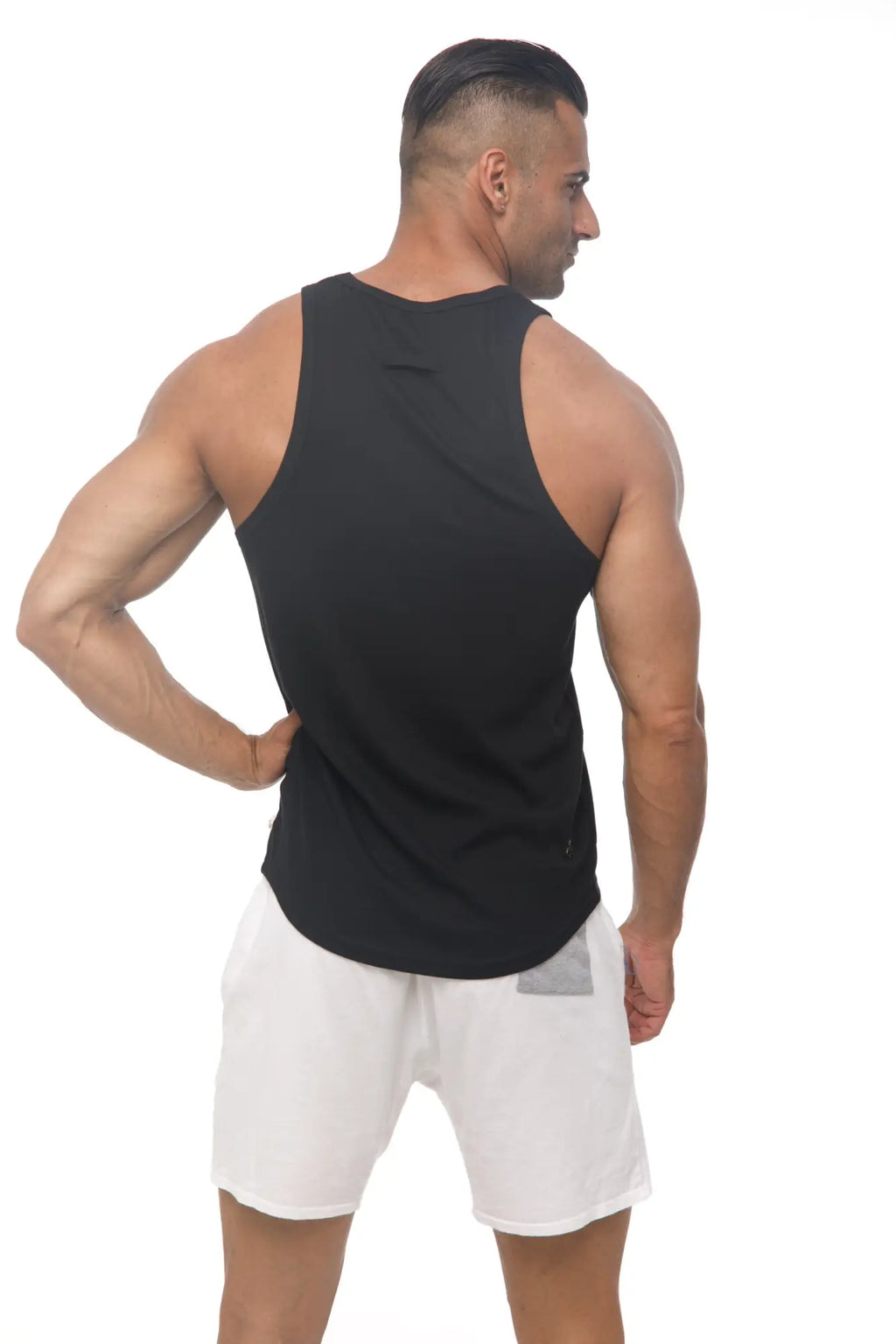 Marcuse Avalon tank top is a black sleeveless athletic top with a rounded neckline and slightly curved hem