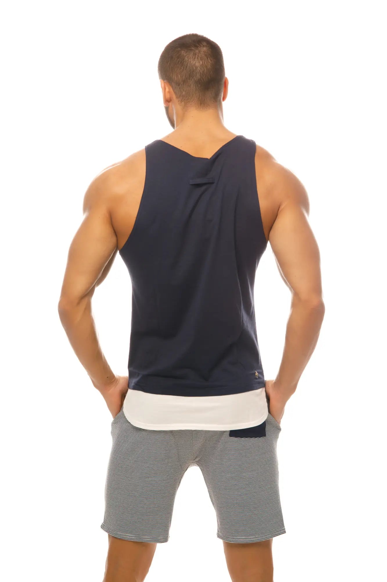 Navy blue sleeveless Marcuse Babe tank top with white inner lining and subtle seam detailing for casual wear