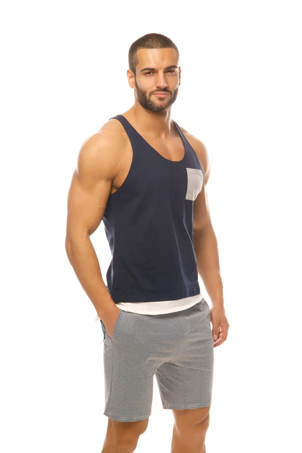 Navy blue Marcuse Babe tank top with a white pocket on the left side made from soft comfortable fabric