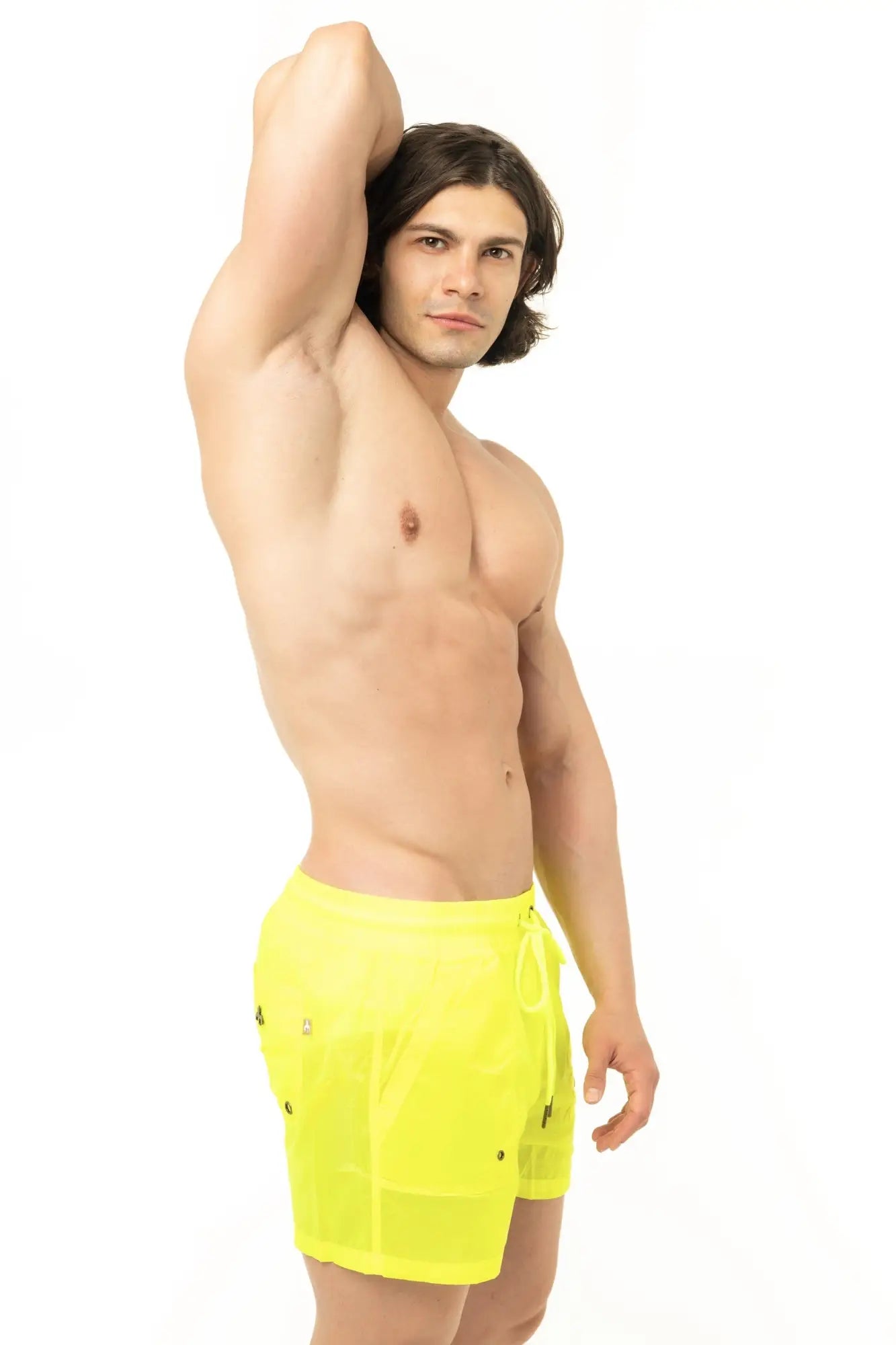 Bright neon yellow marcuse babylon swim trunks with drawstring waist and black button details on sides