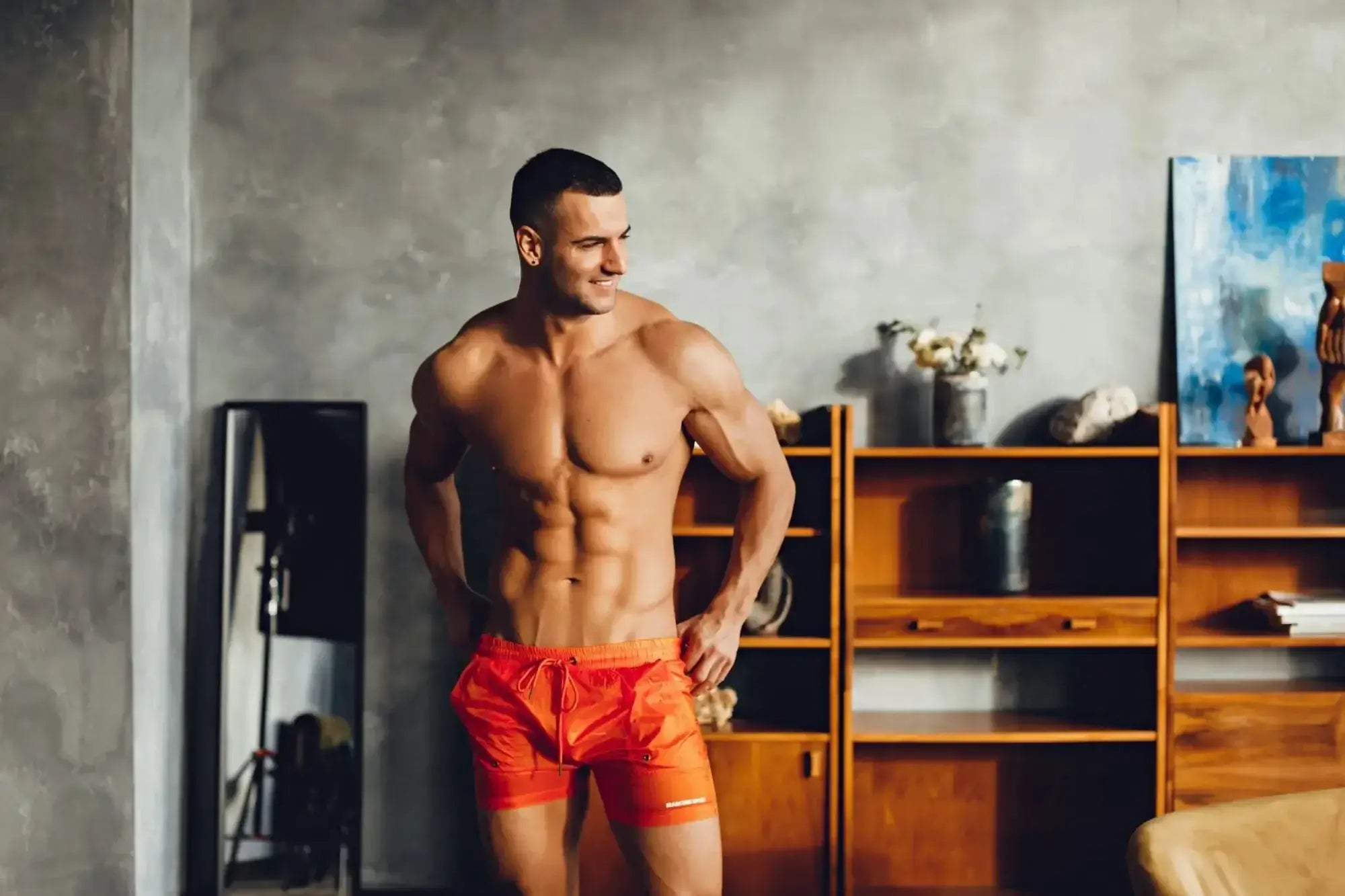 Orange marcuse babylon athletic shorts with drawstring waistband made from lightweight breathable fabric