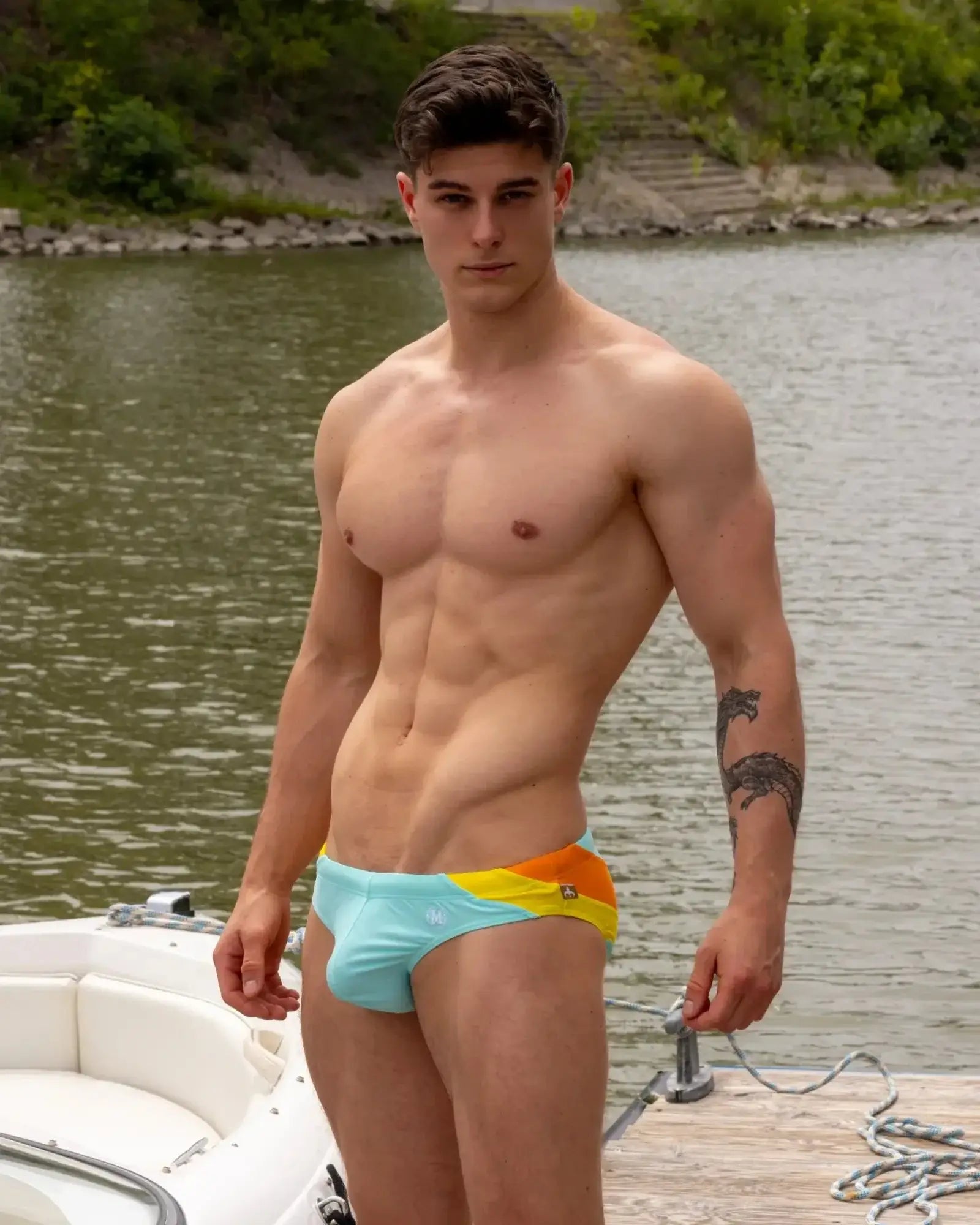 Light blue and yellow striped Marcuse Bahama bikini swimwear with a small logo on the side for beachwear use