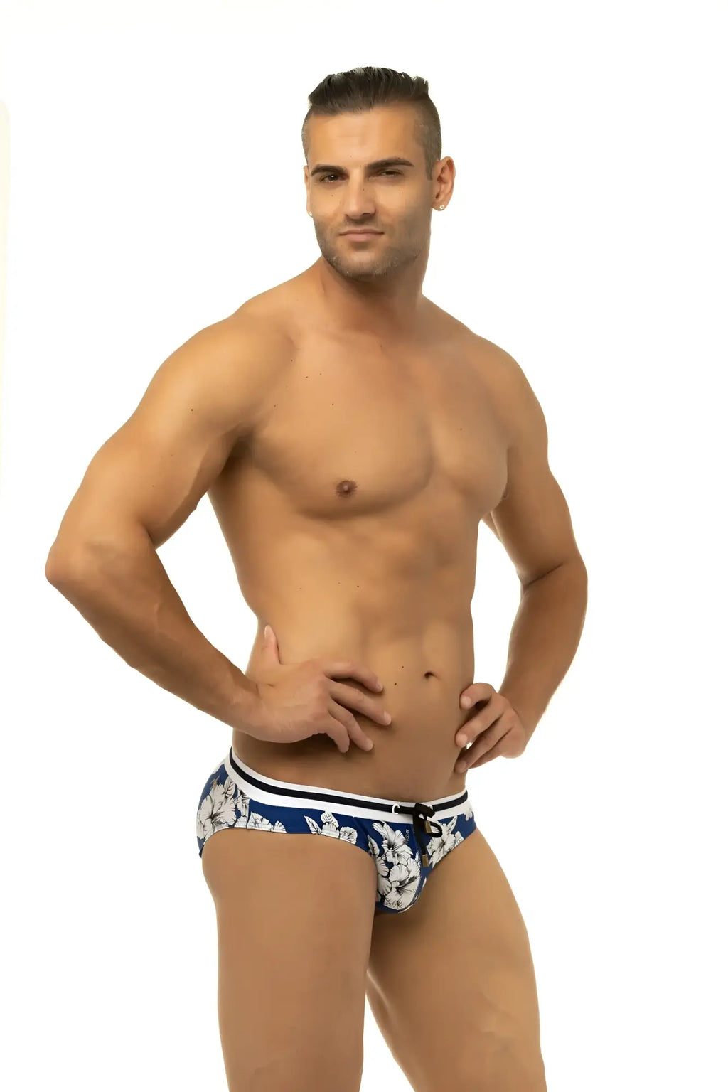 Blue marcuse botany bikini swimwear trunks with white floral pattern and black and white striped waistband