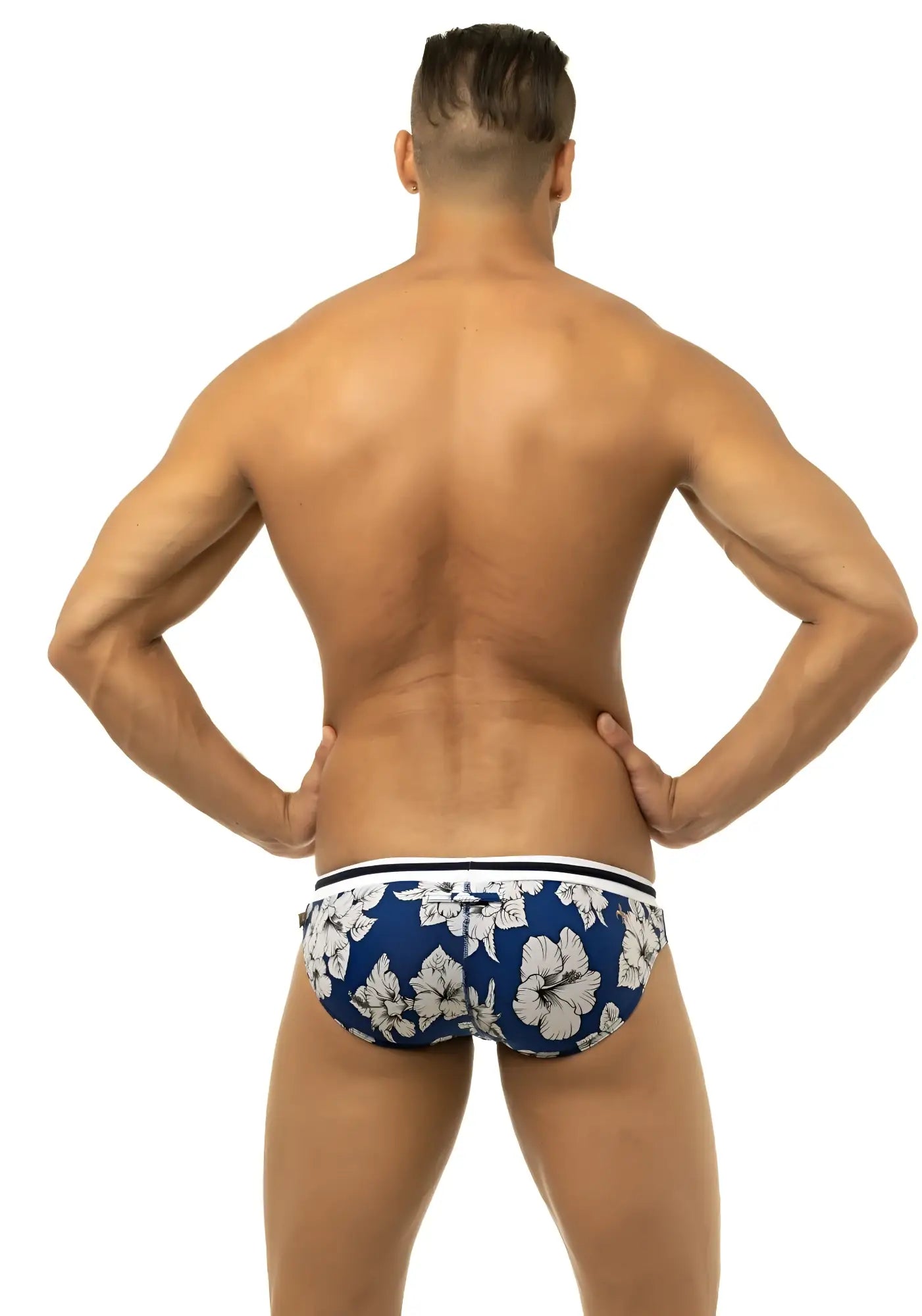 Marcuse Botany bikini swimwear blue swim trunks with white hibiscus flower pattern and striped waistband
