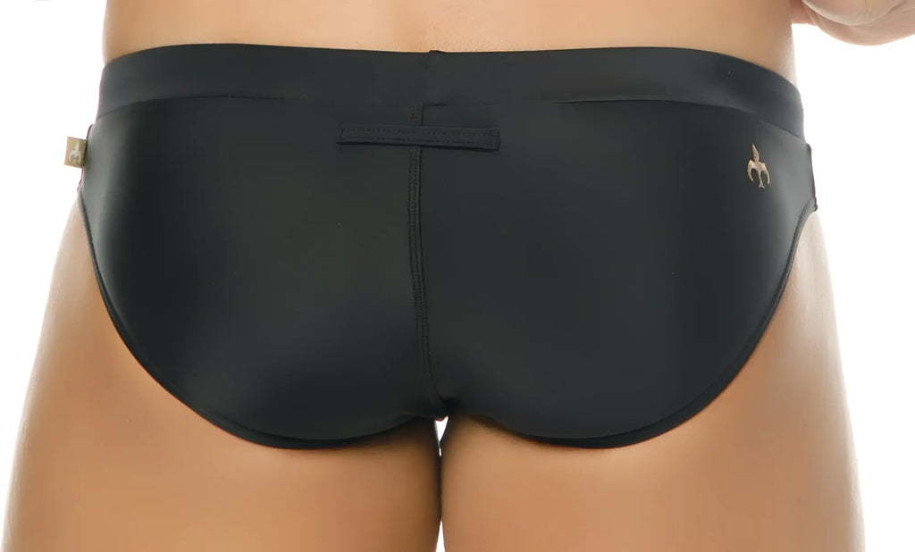 Black Marcuse Burleigh bikini swimwear trunks with sleek smooth fabric and a small gold logo on the side