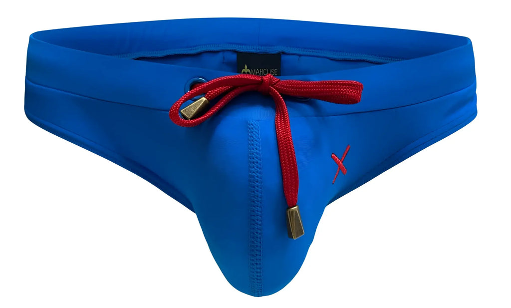 Bright blue marcuse burleigh bikini swimwear men’s swim trunks with red drawstring gold-tone aglets and side embroidered x