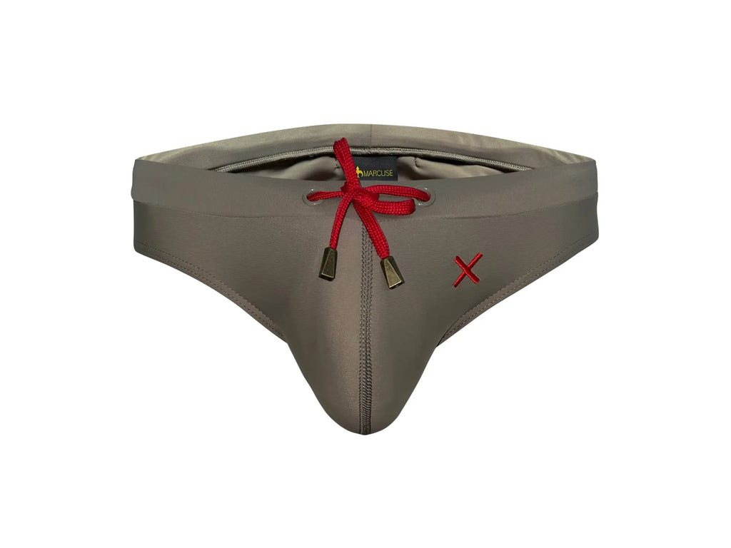Gray men’s swim trunks with red drawstring and embroidered x on side from marcuse burleigh bikini swimwear