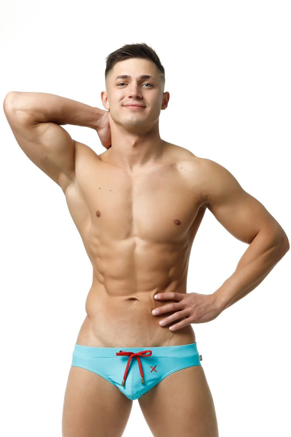 Marcuse Burleigh bikini swimwear light blue swim trunks with red drawstring and small x logo on the front
