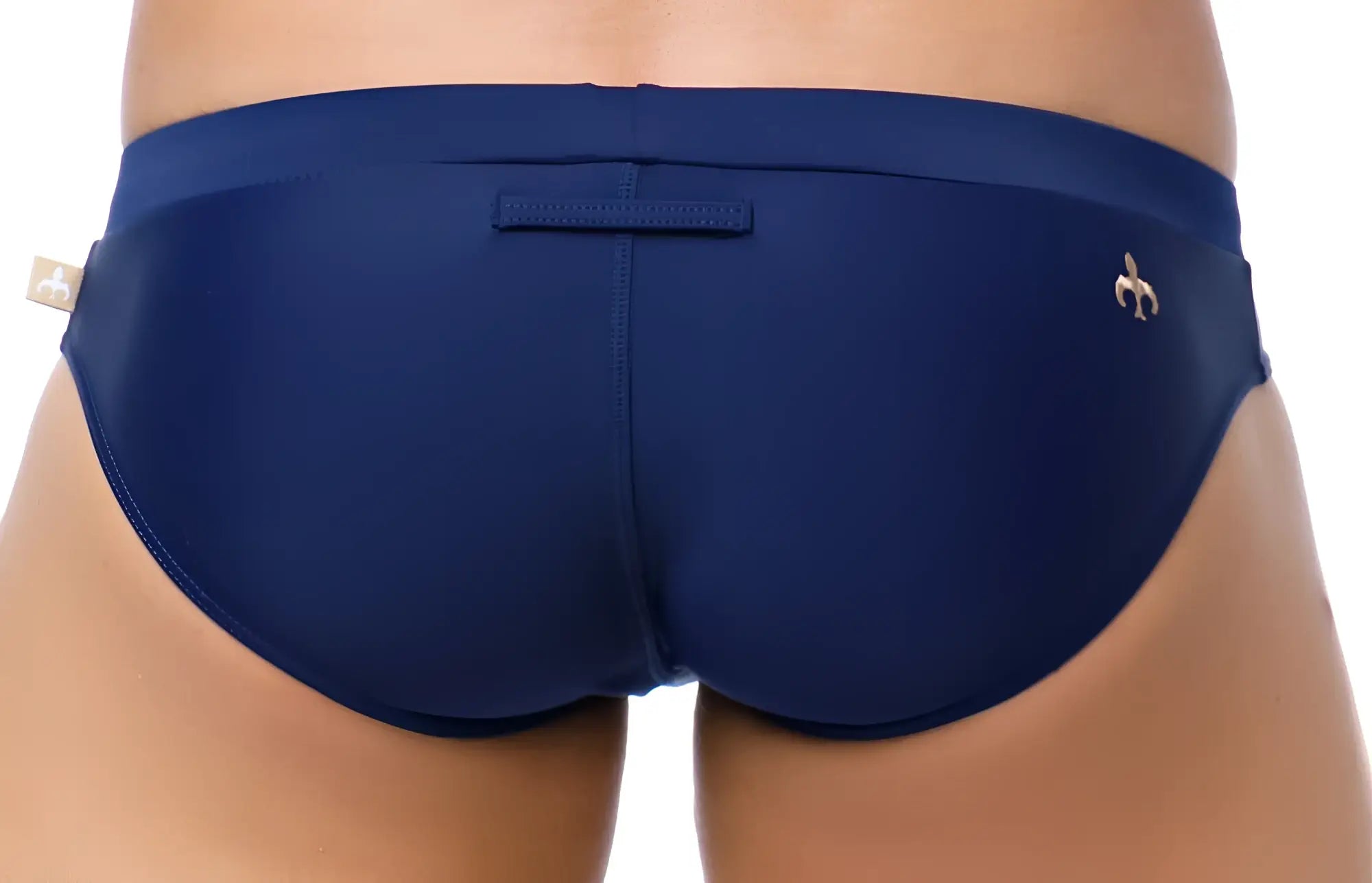 Navy blue marcuse burleigh bikini swimwear with a gold fleur-de-lis logo on the right hip and a left waistband tag