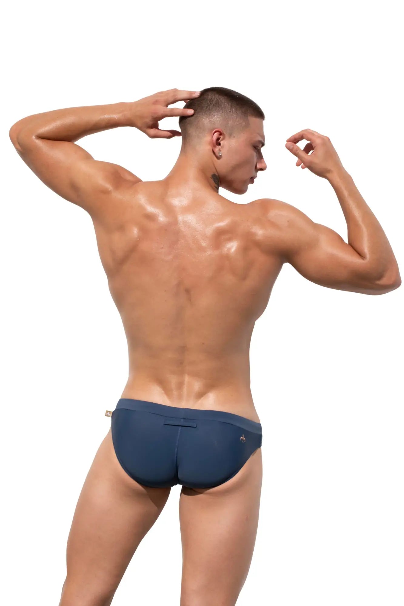 Navy blue Marcuse Burleigh bikini swimwear trunks with small logo on waistband designed for swimming and beachwear