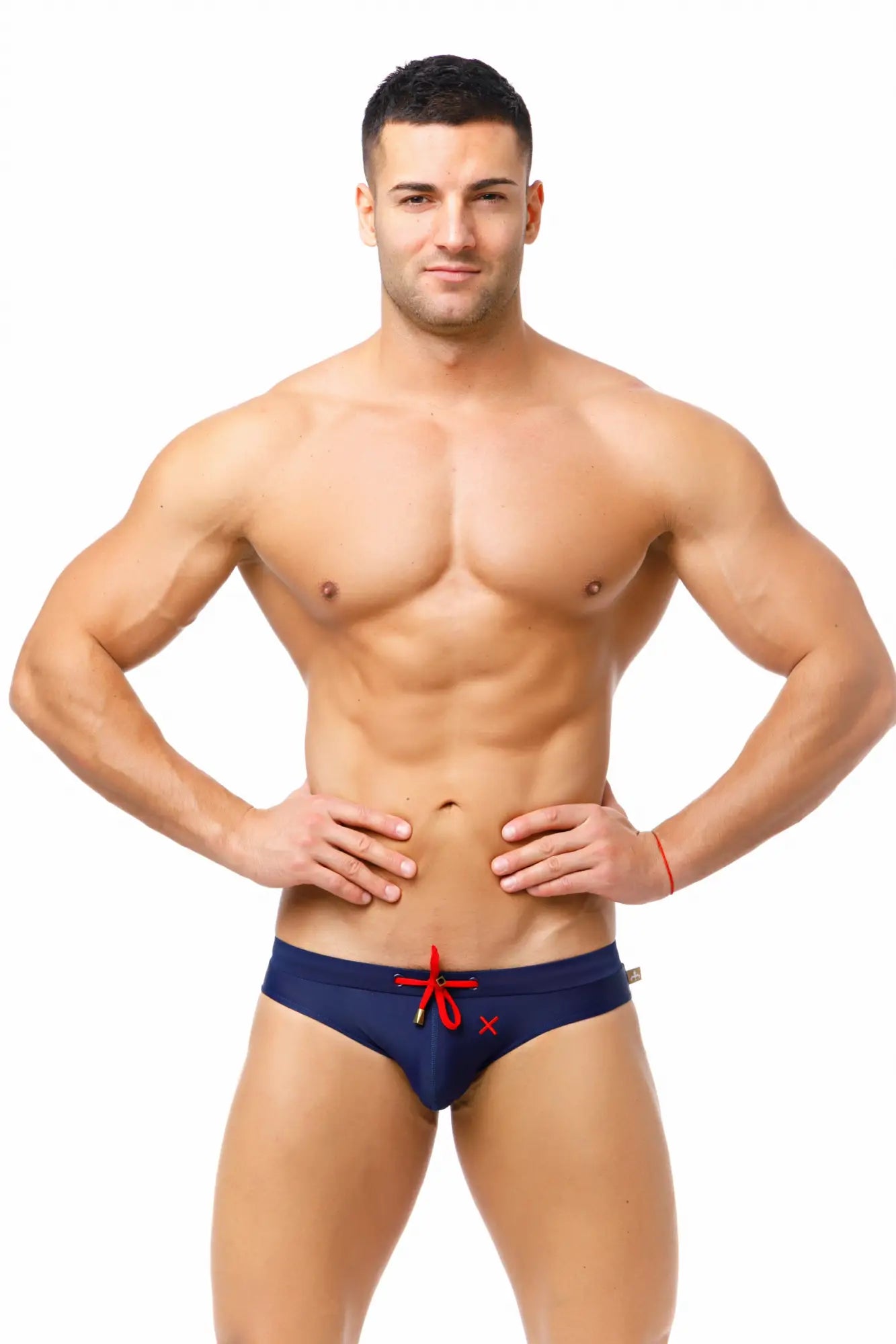 Marcuse Burleigh bikini swimwear navy blue swim trunks with red drawstring and small x-shaped logo detail