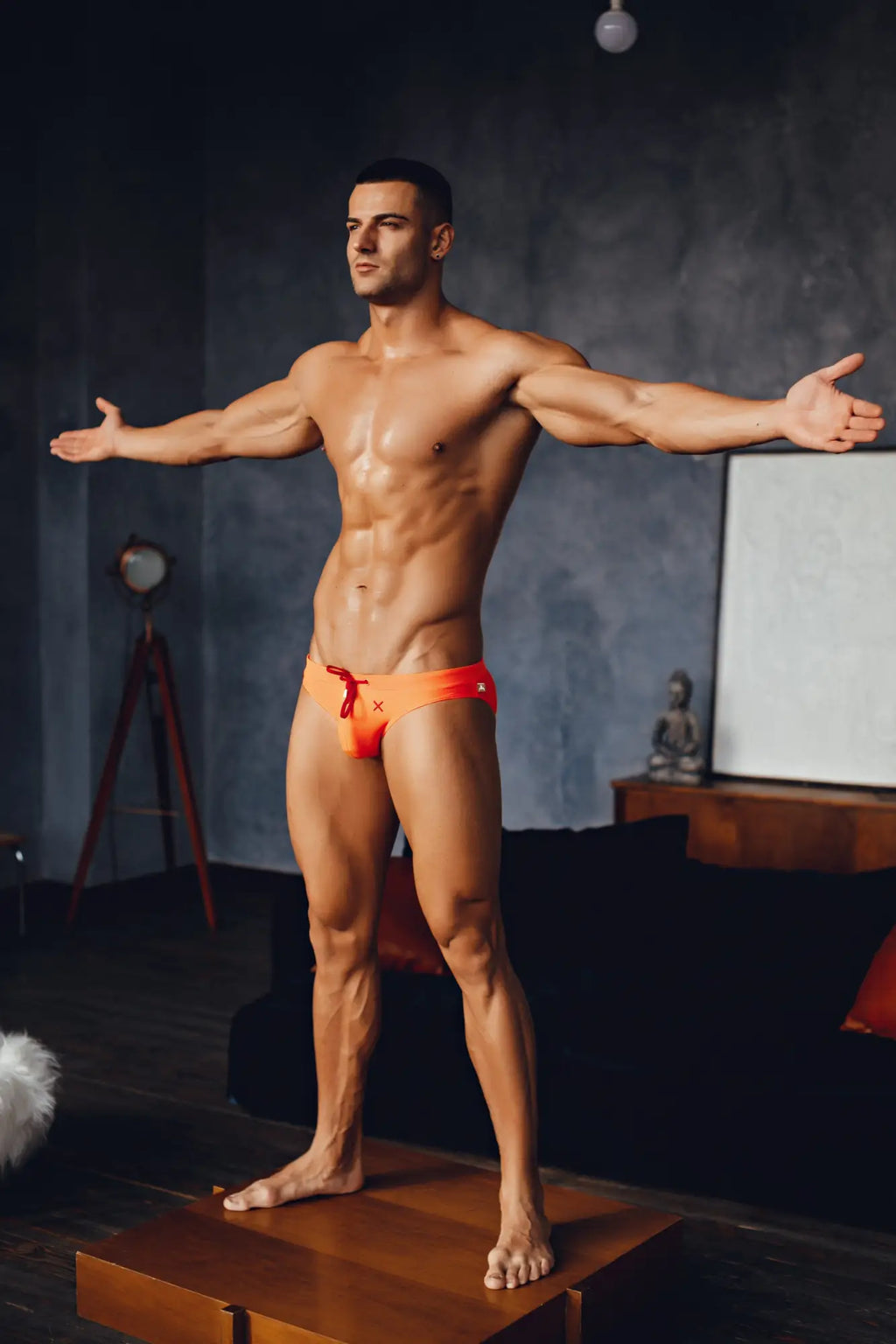 Orange marcuse burleigh bikini swimwear swim trunks with red drawstrings and a small white front logo