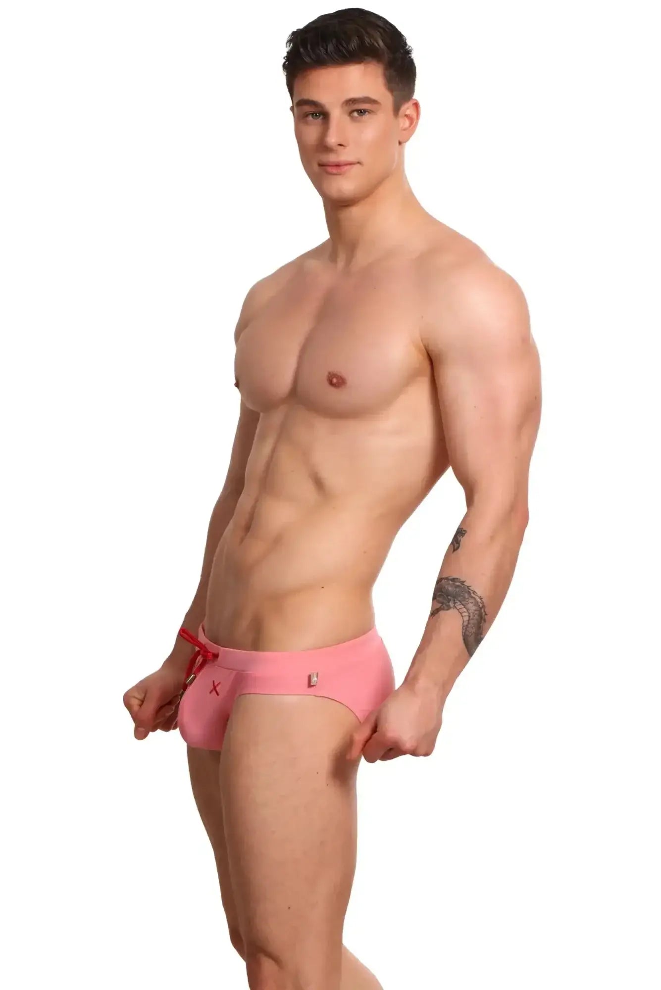 Pink marcuse burleigh bikini swimwear swim trunks with red drawstring and small logo details for beachwear