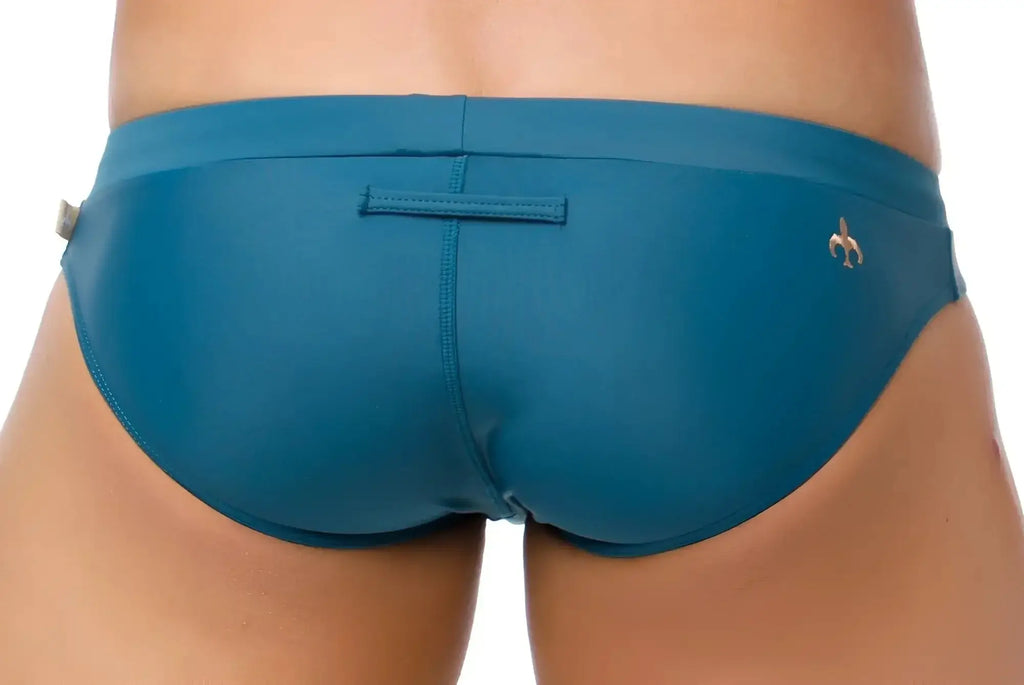 Teal marcuse burleigh bikini swimwear with sleek form-fitting design and small gold fleur-de-lis logo on the side