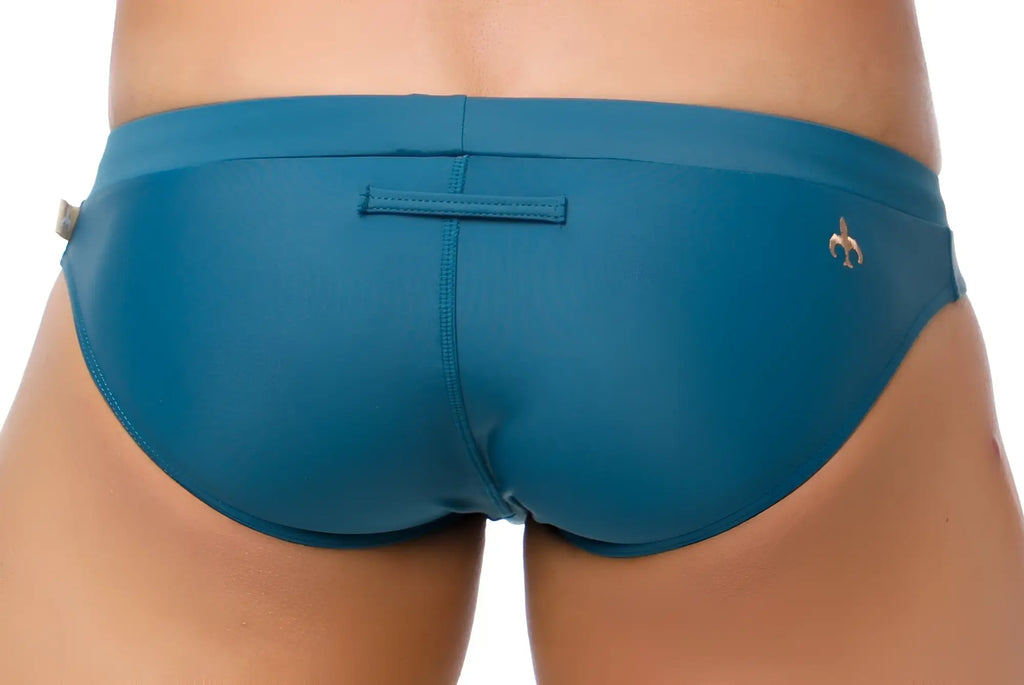 Teal marcuse burleigh bikini swimwear with sleek form-fitting design and small gold fleur-de-lis logo on the side