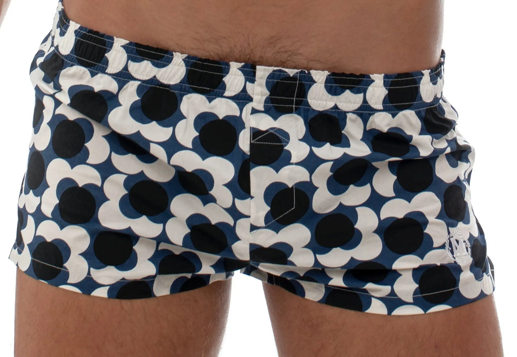 Marcuse Caleçon boxer underwear featuring blue and white floral patterned swim trunks with black circular centers