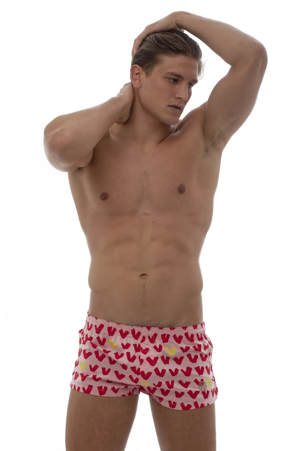 Marcuse caleçon boxer underwear in pink swim trunks with a repeating red and yellow heart pattern