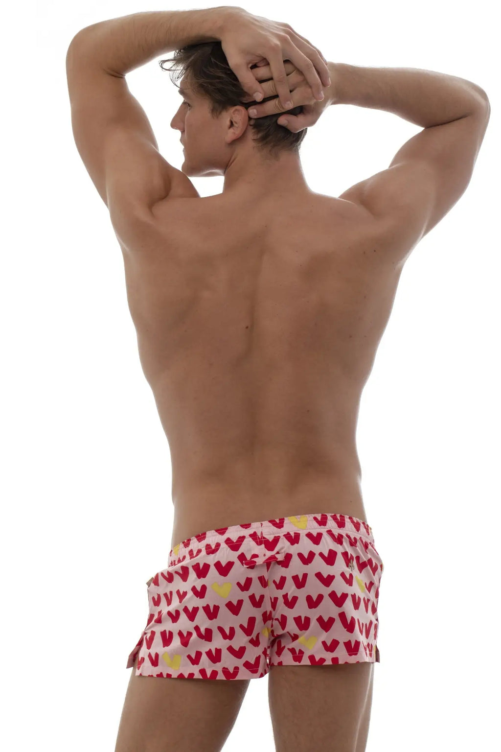 Marcuse Caleçon boxer underwear red and yellow heart patterned swim trunks worn by model front view
