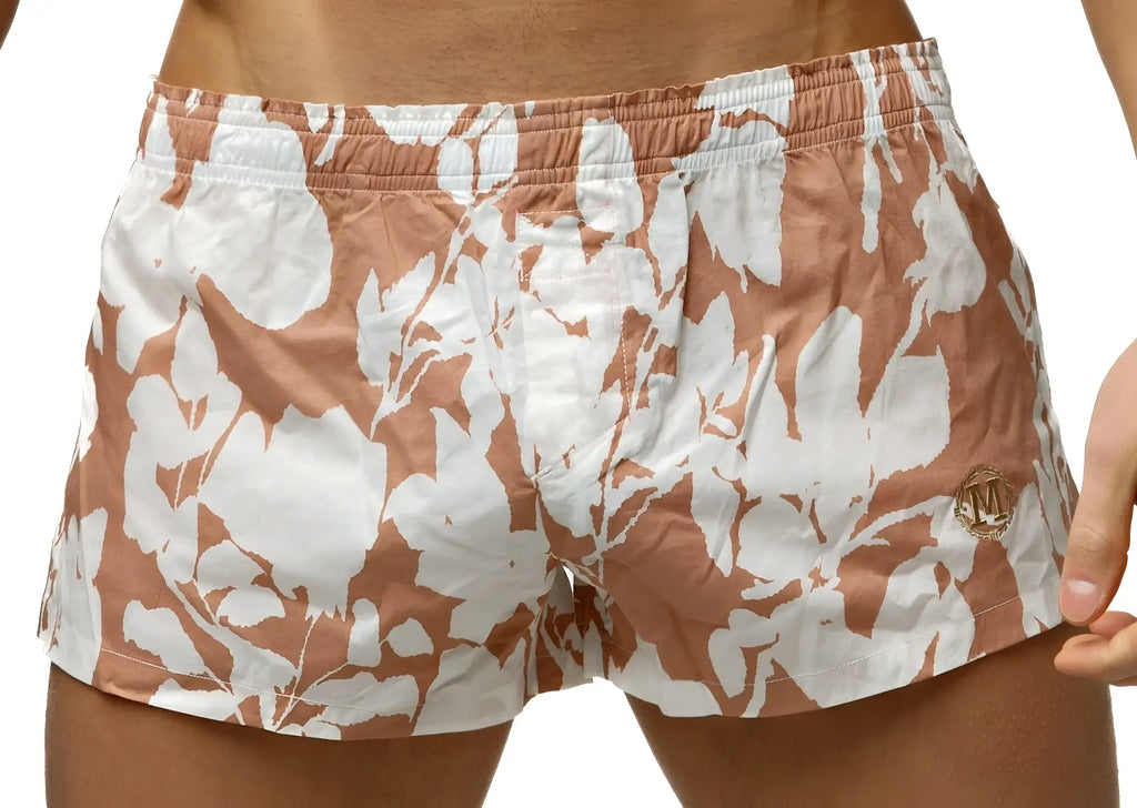 Marcuse Caleçon boxer underwear tan and white floral swim trunks with gold logo on the lower right leg