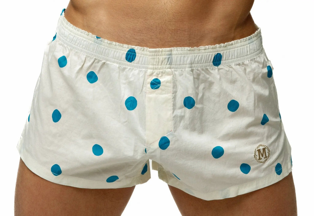 White men’s marcuse caleçon boxer underwear with blue polka dots and gold embroidered logo on lower right leg