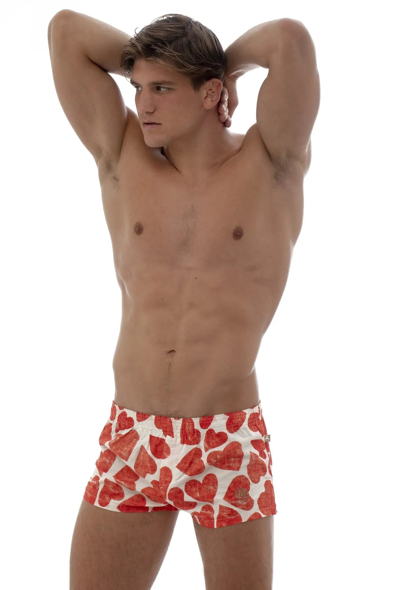White swim trunks by marcuse caleçon boxer underwear featuring a vibrant red heart pattern on lightweight fabric
