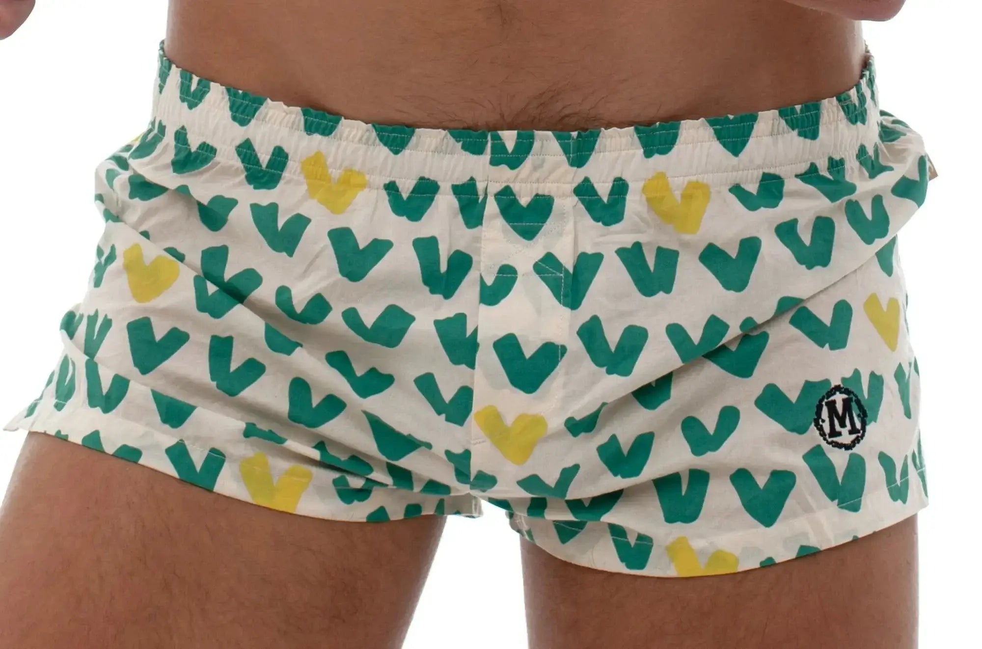 White marcuse caleçon boxer underwear with teal and yellow heart pattern and small circular logo on lower right leg