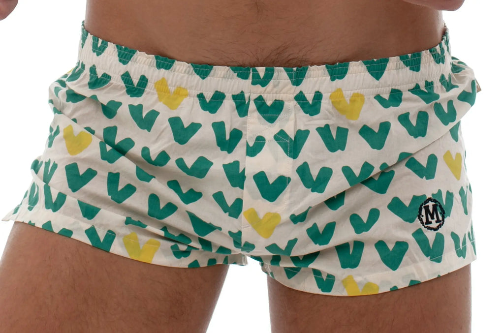 White marcuse caleçon boxer underwear with teal and yellow heart pattern and small circular logo on lower right leg