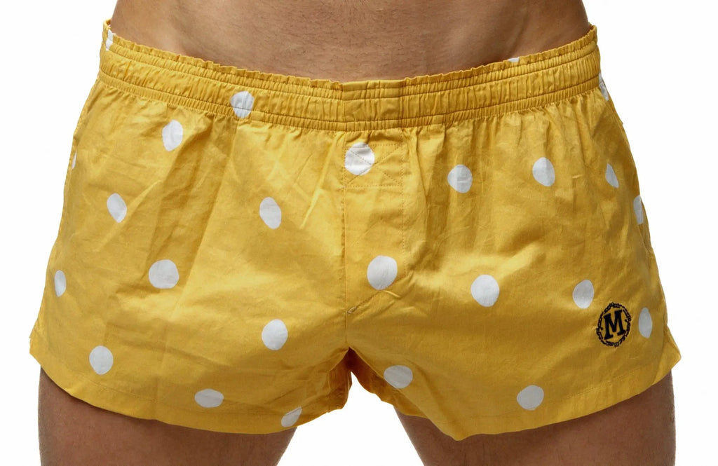 Marcuse Caleçon boxer underwear in yellow polka-dot swim trunks with black embroidered logo on lower right leg