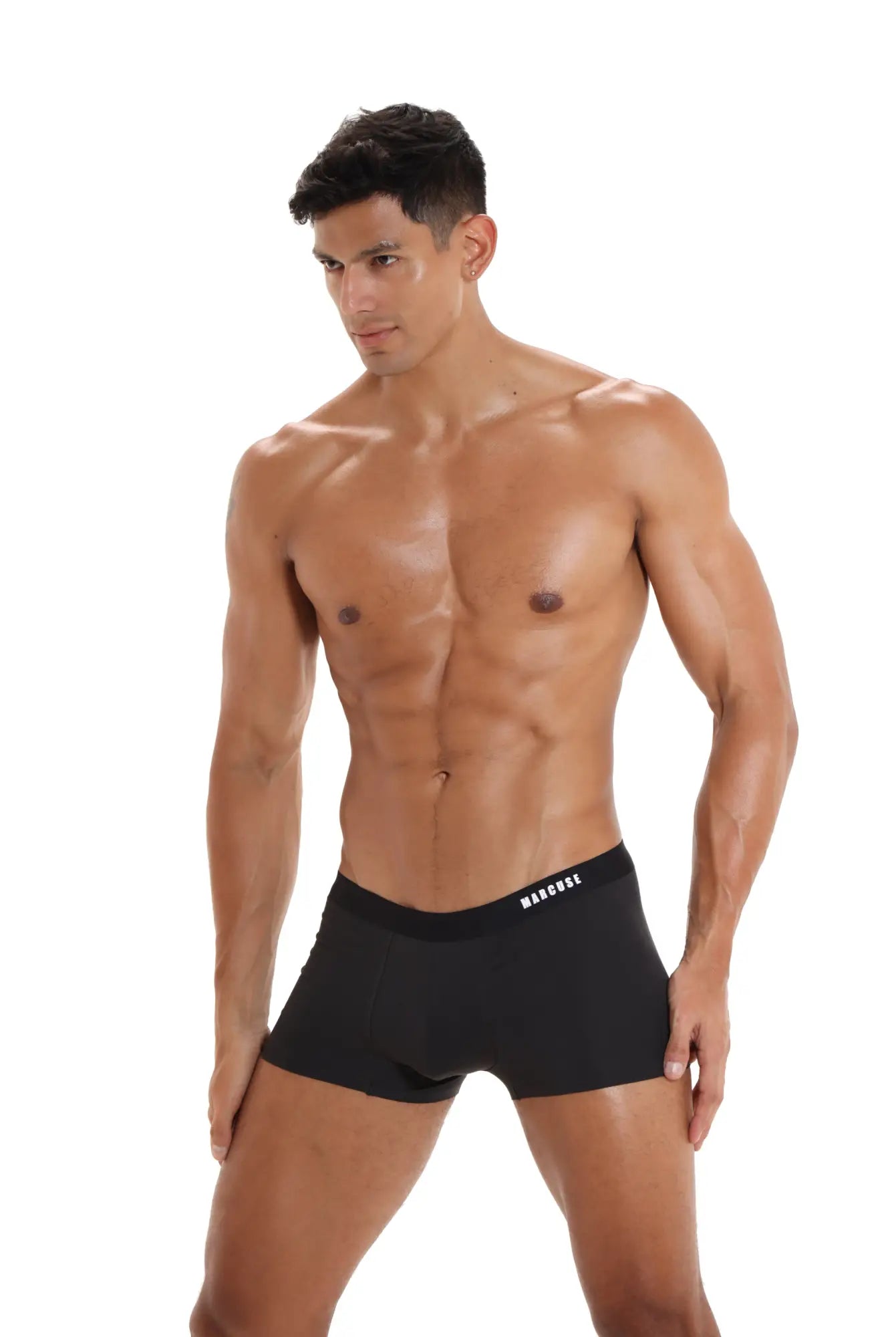 Black men’s briefs with a subtle white marciel logo on the waistband from the marcuse dandy boxer underwear collection