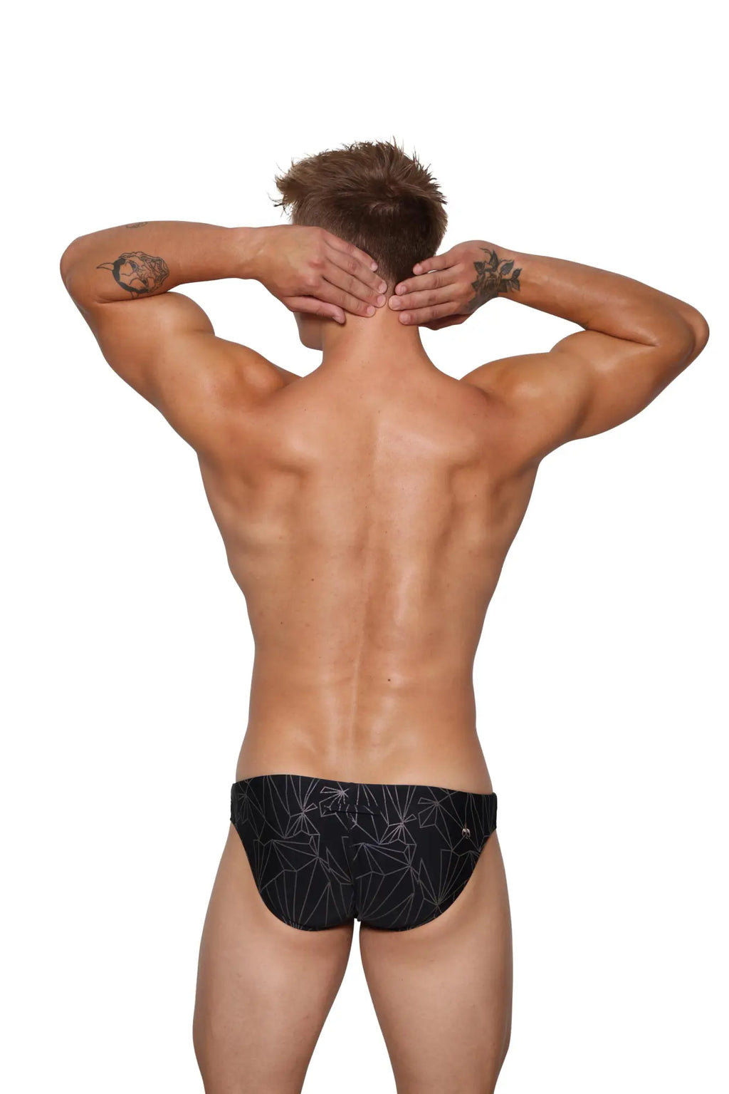 Black Marcuse Discothèque bikini swimwear featuring white geometric pattern on swim trunks front view