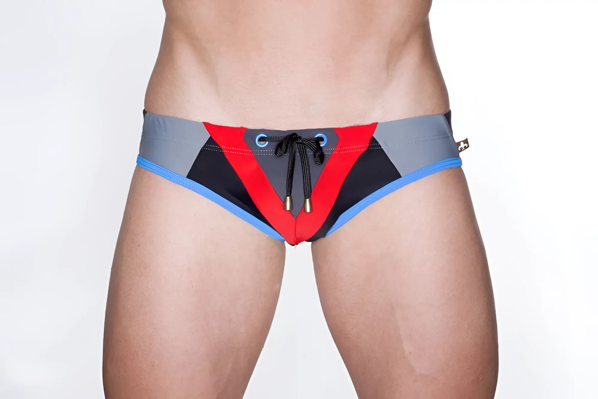 Marcuse Efficio bikini swimwear featuring red black and gray geometric patterned swim trunks with blue trim and drawstring closure