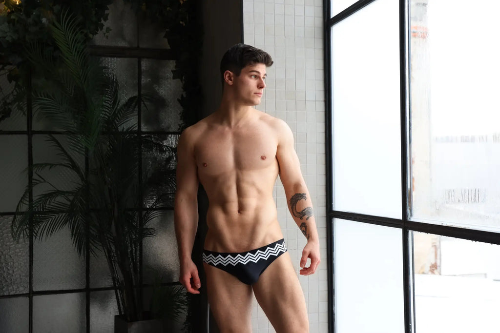 Marcuse Everest bikini swimwear black swim trunks with bold white zigzag pattern on the waistband