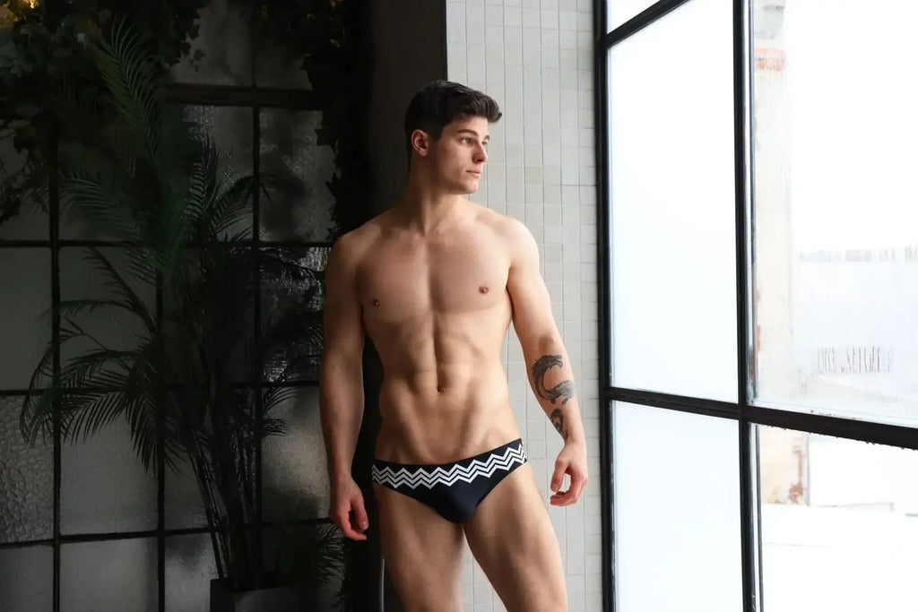 Marcuse Everest bikini swimwear black swim trunks with bold white zigzag pattern on the waistband