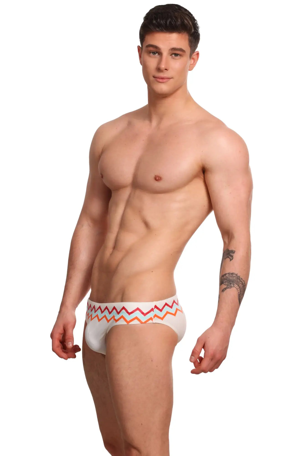 White marcuse everest bikini swimwear briefs with vibrant pink and orange zigzag waistband pattern