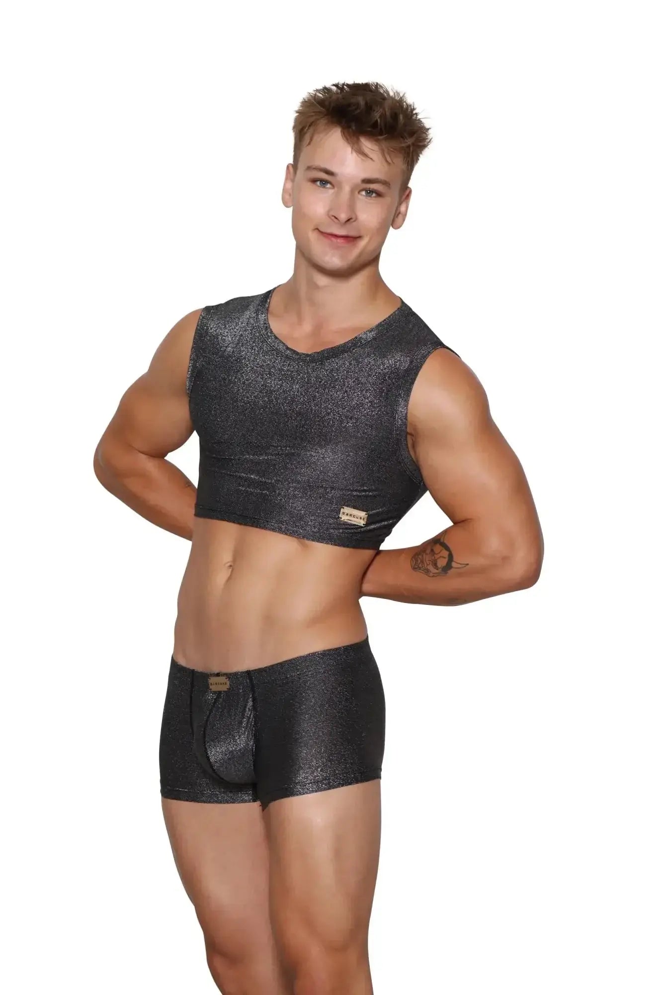 Marcuse glisten sleeveless crop tank in shiny black glitter with a small gold logo patch on the left side