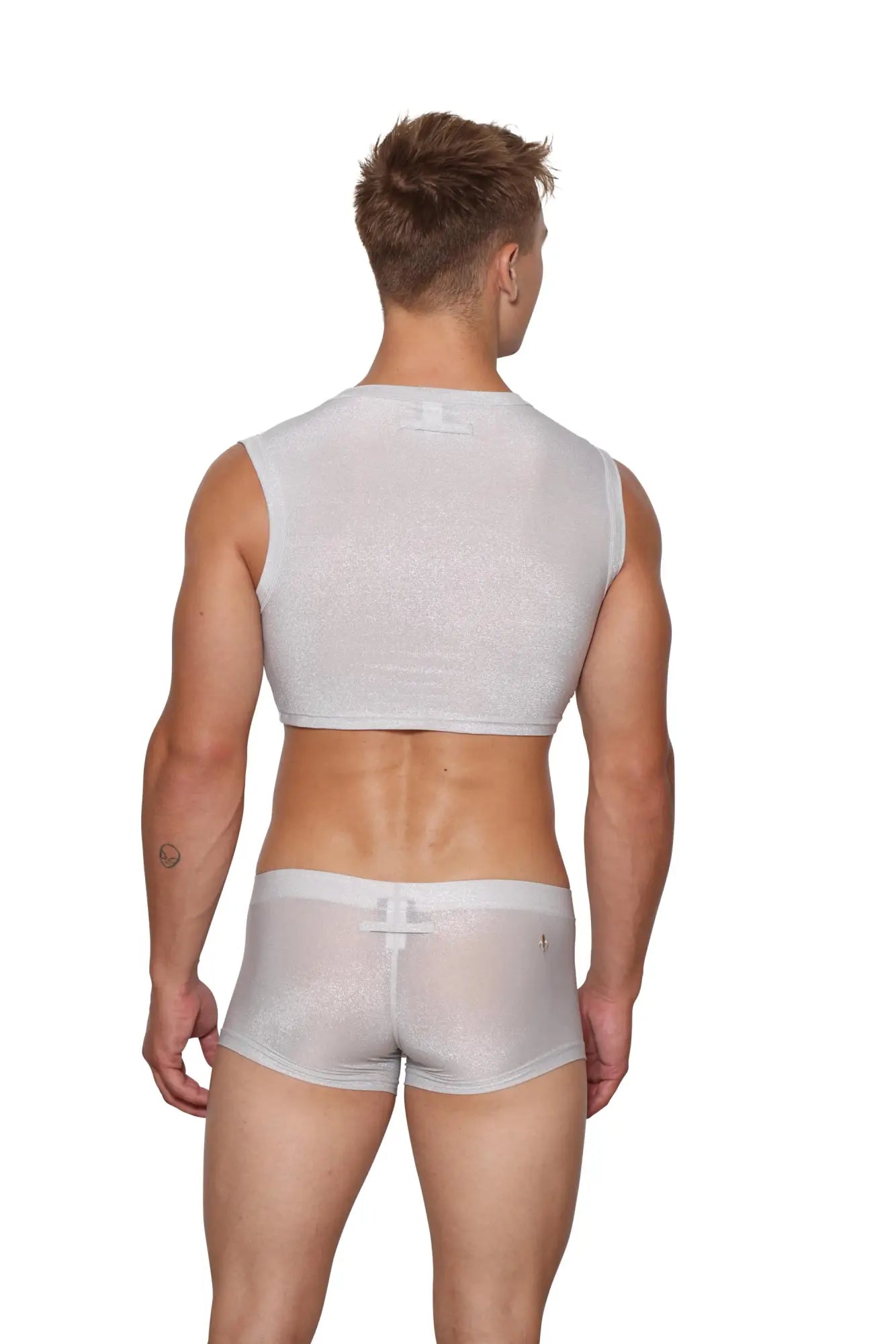 Back view of marcuse glisten crop tank in white sheer mesh with bow detail and matching shorts with bow on waistband