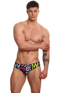 Black marcuse haider bikini swimwear swim trunks with vibrant graffiti style pink and neon green lettering pattern